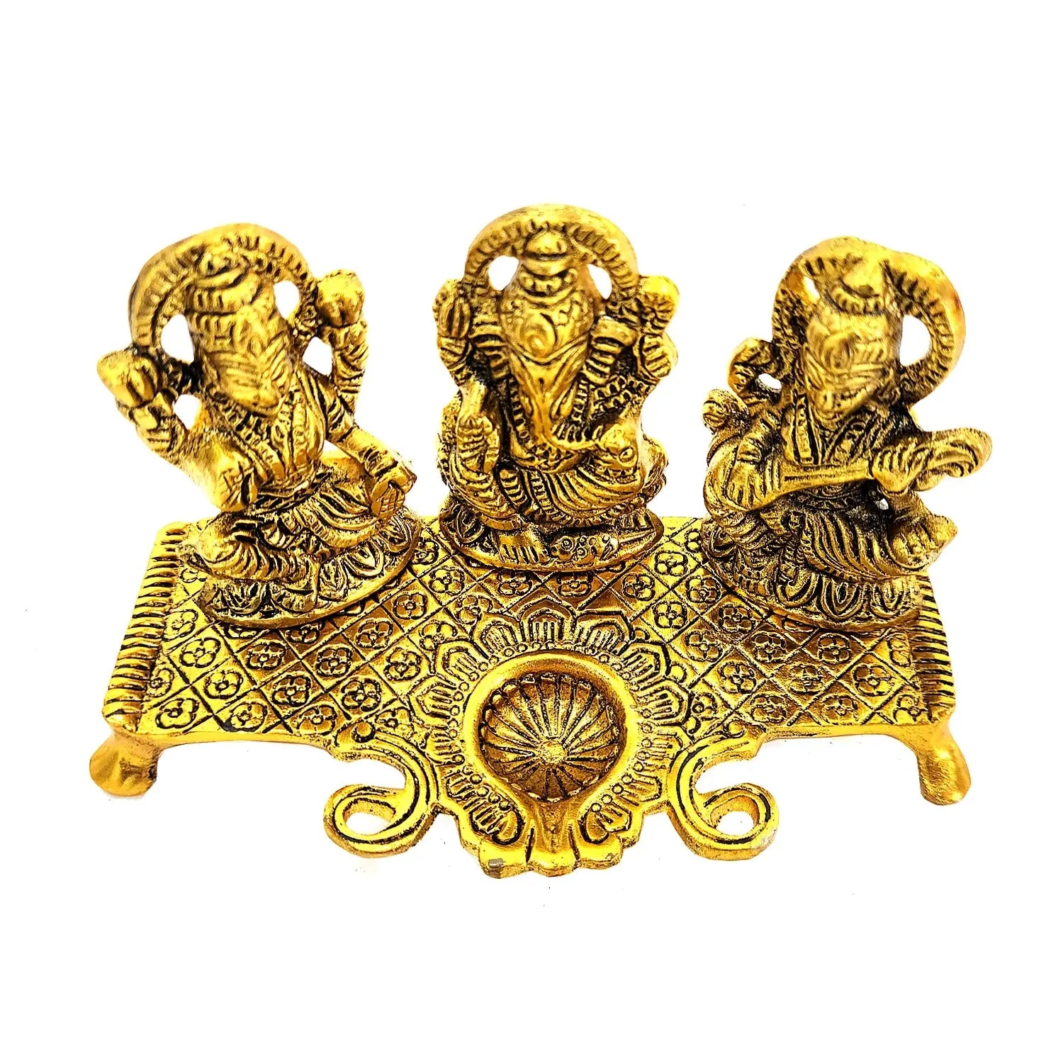 Gold-colored decorative item with three figures on a white background