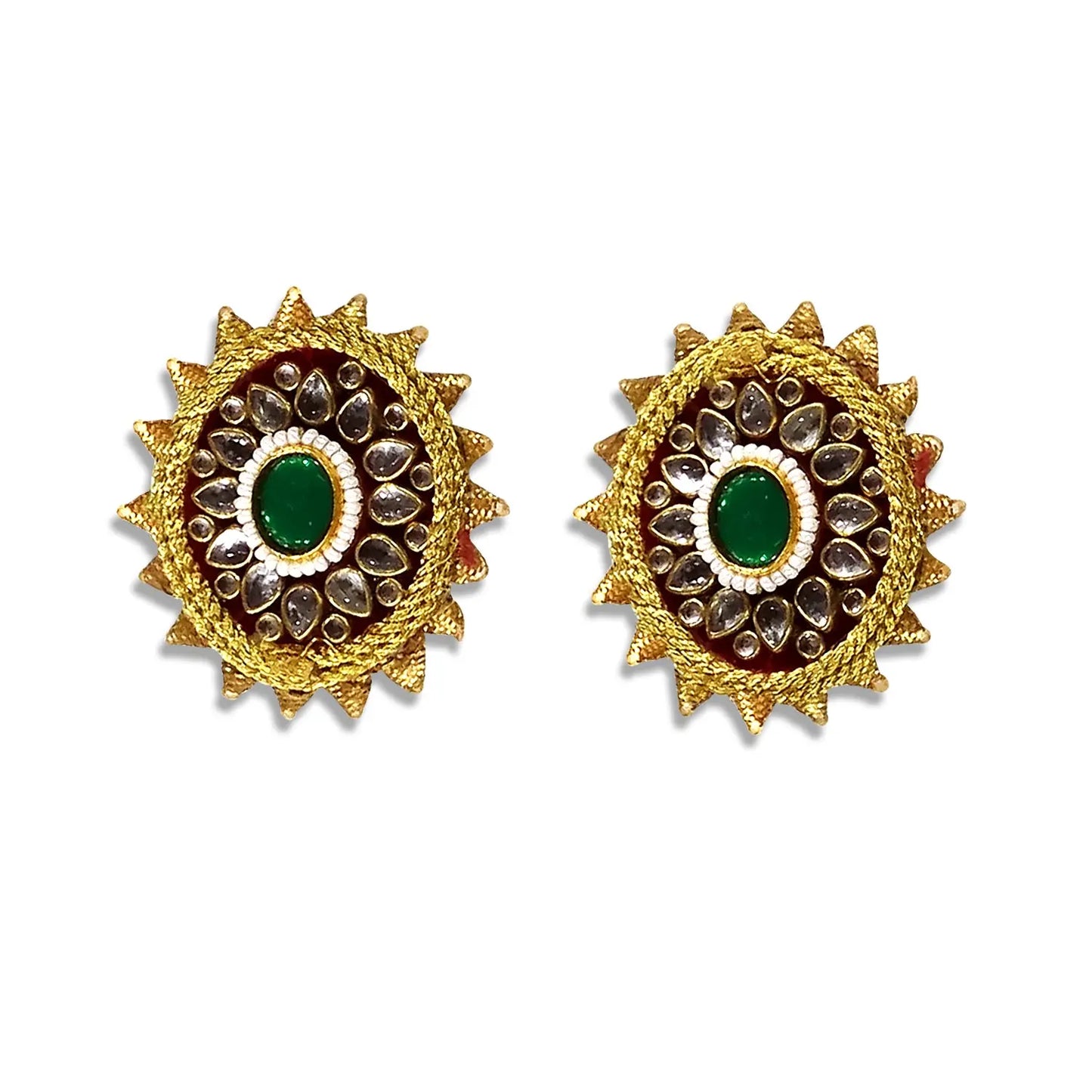 Pair of gold earrings with green gemstones on a white background
