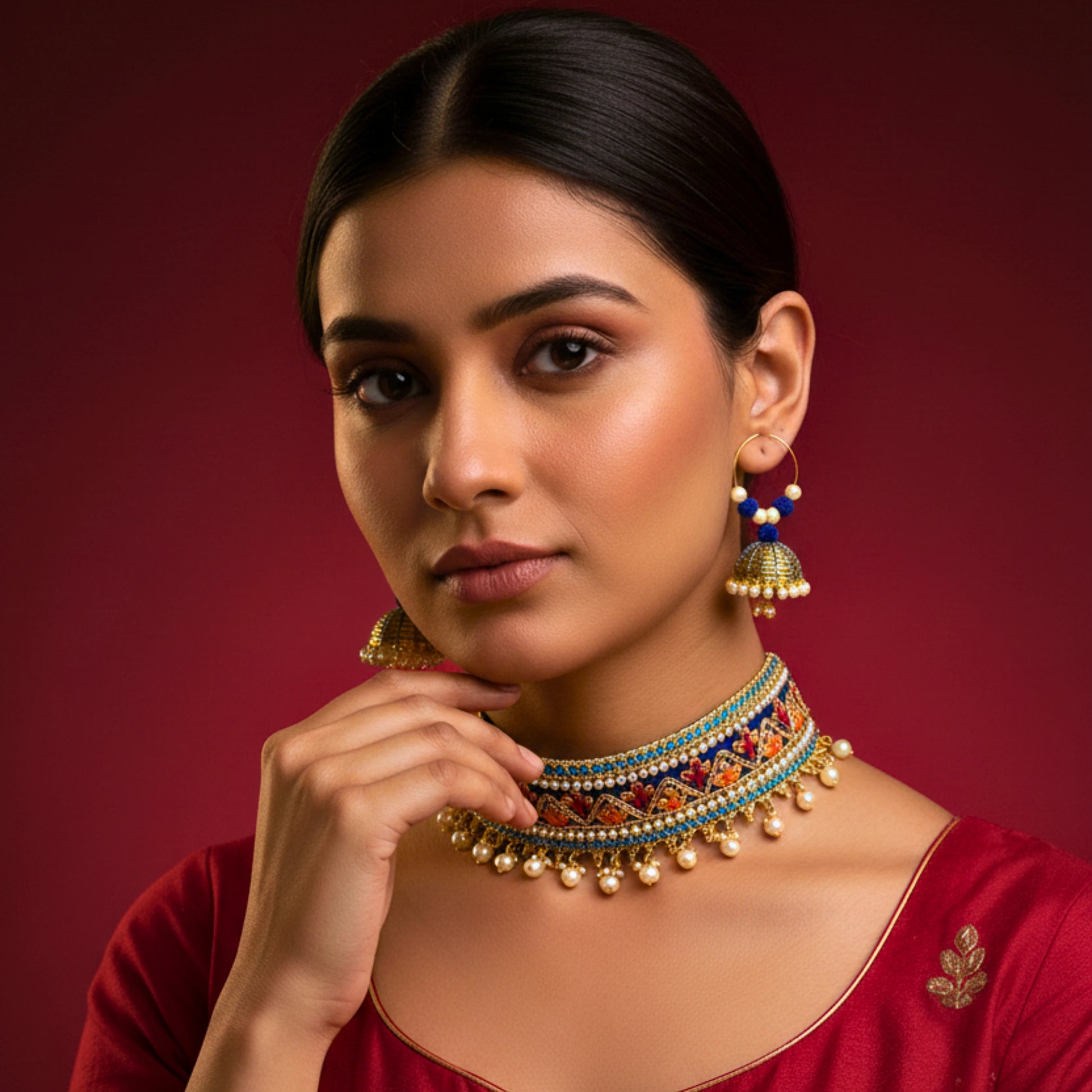 Decorative necklace with colorful stones and pearl-like beads on a black mannequin.