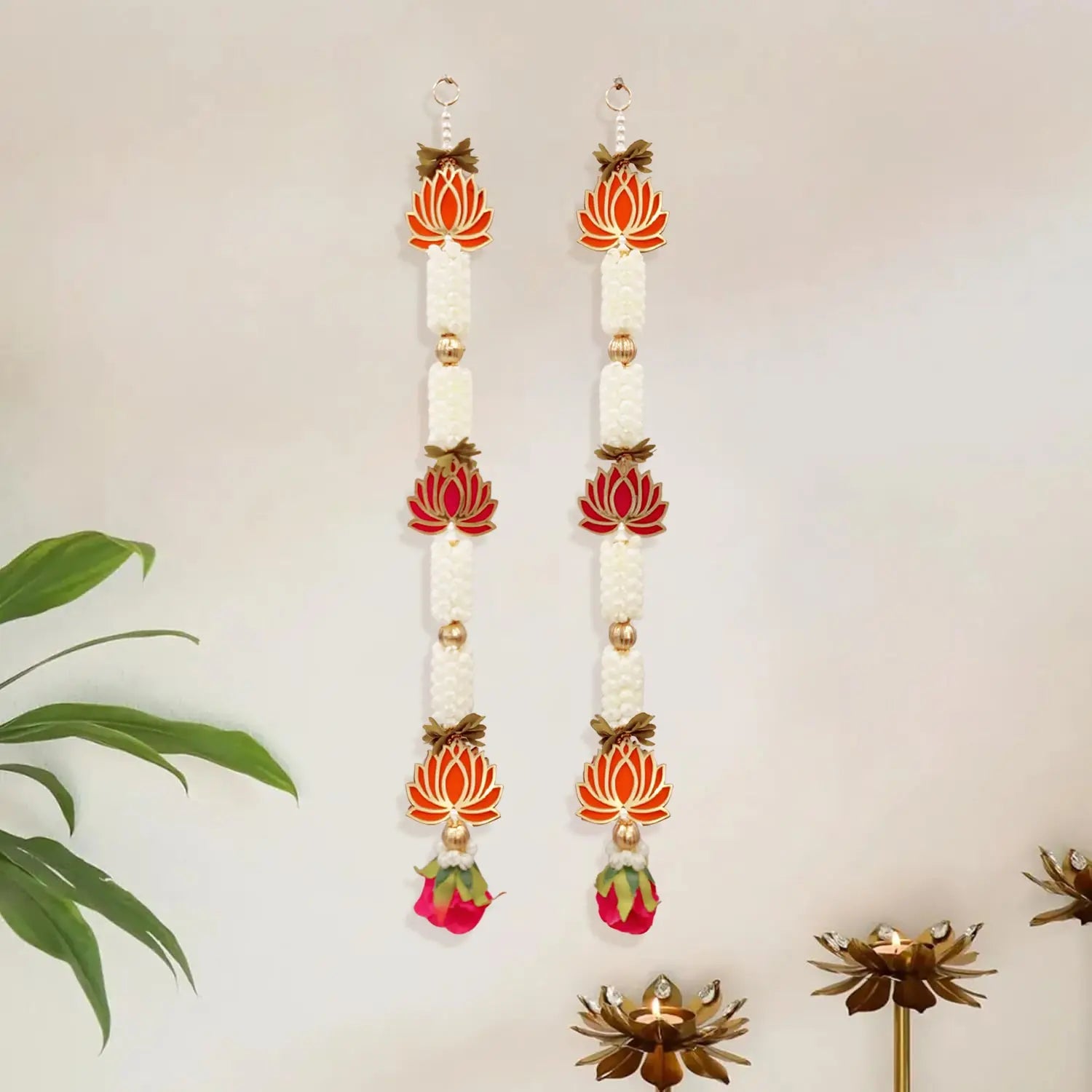 Decorative earrings with floral designs on a neutral background