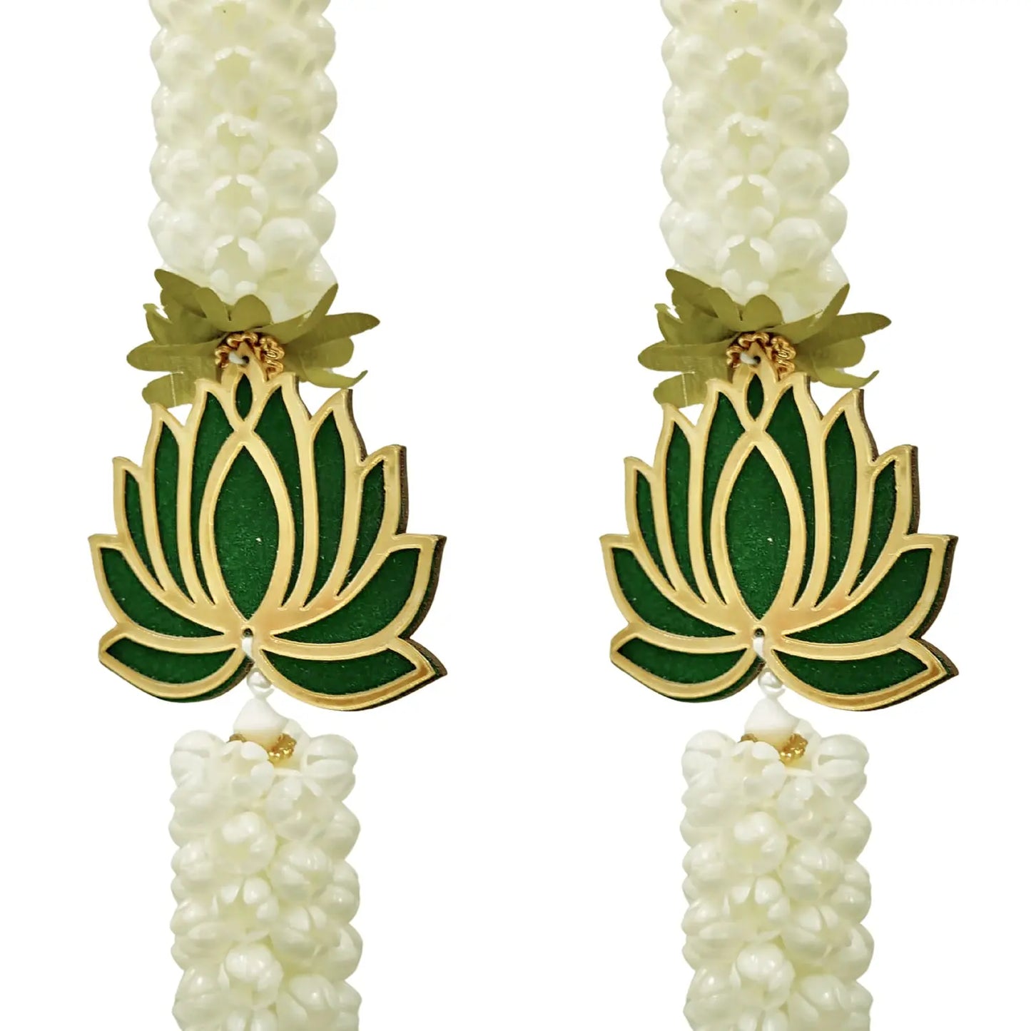 Pair of earrings with green lotus flower designs on a white background