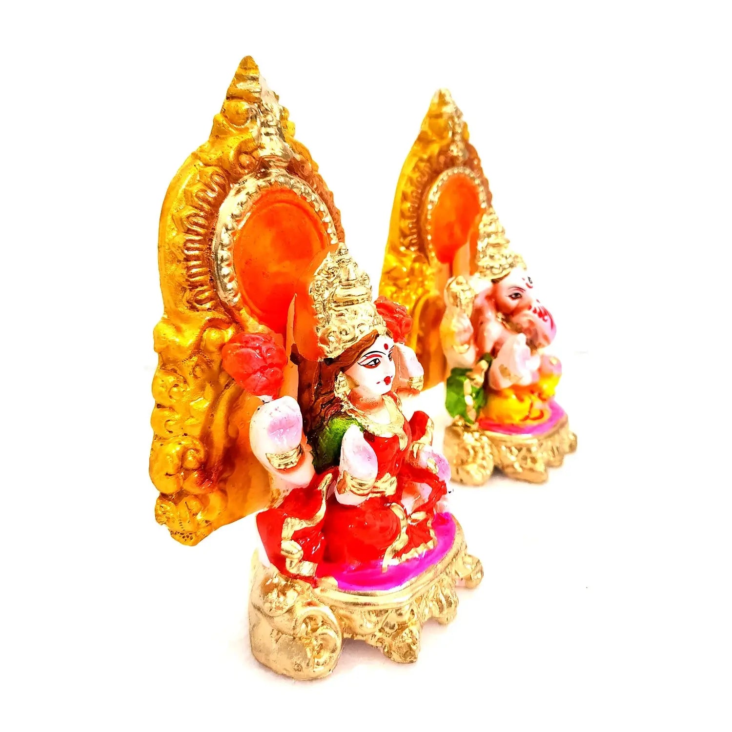 Decorative figurines with gold, red, and pink colors on a white background
