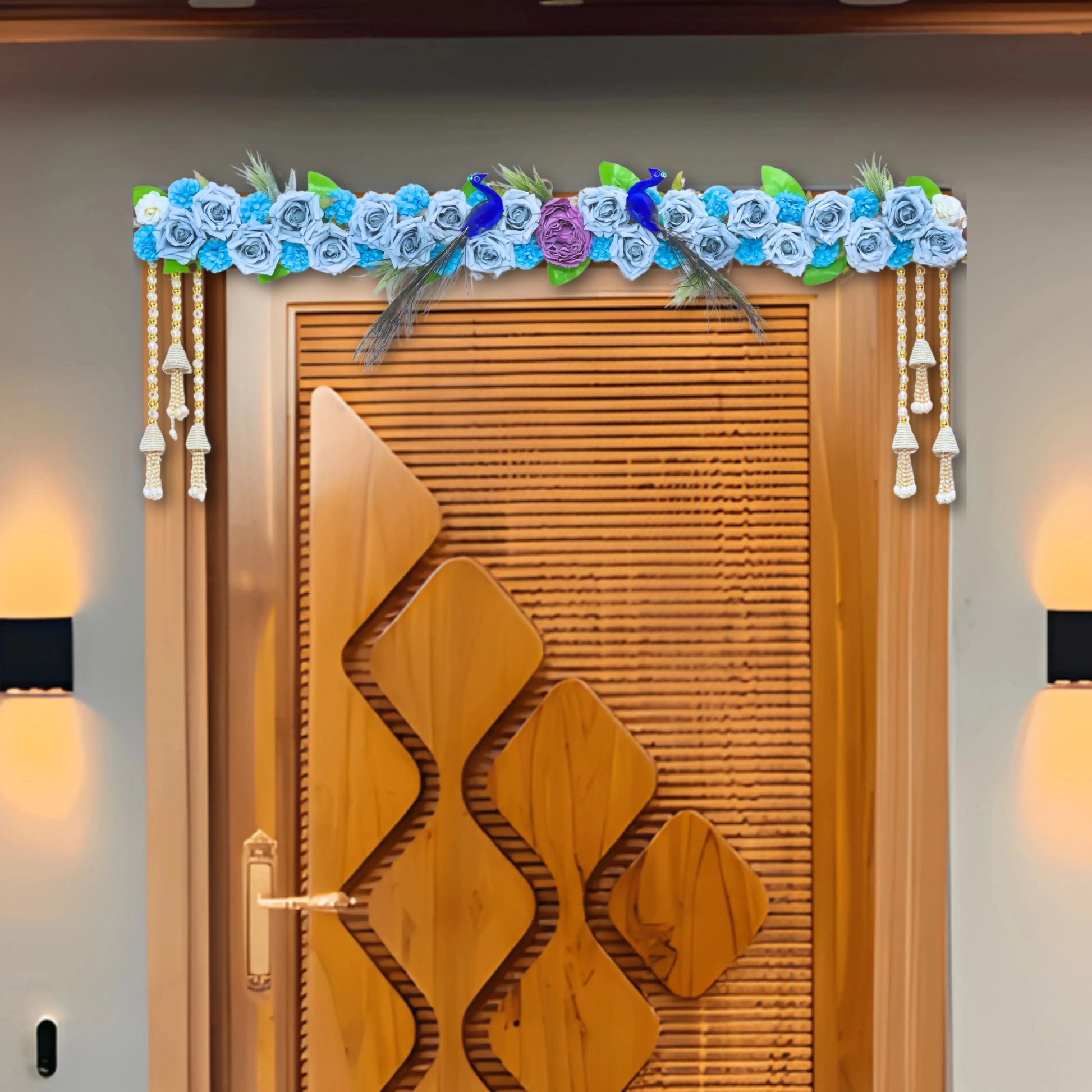 Decorative wooden door with floral arch and lights on a gray wall