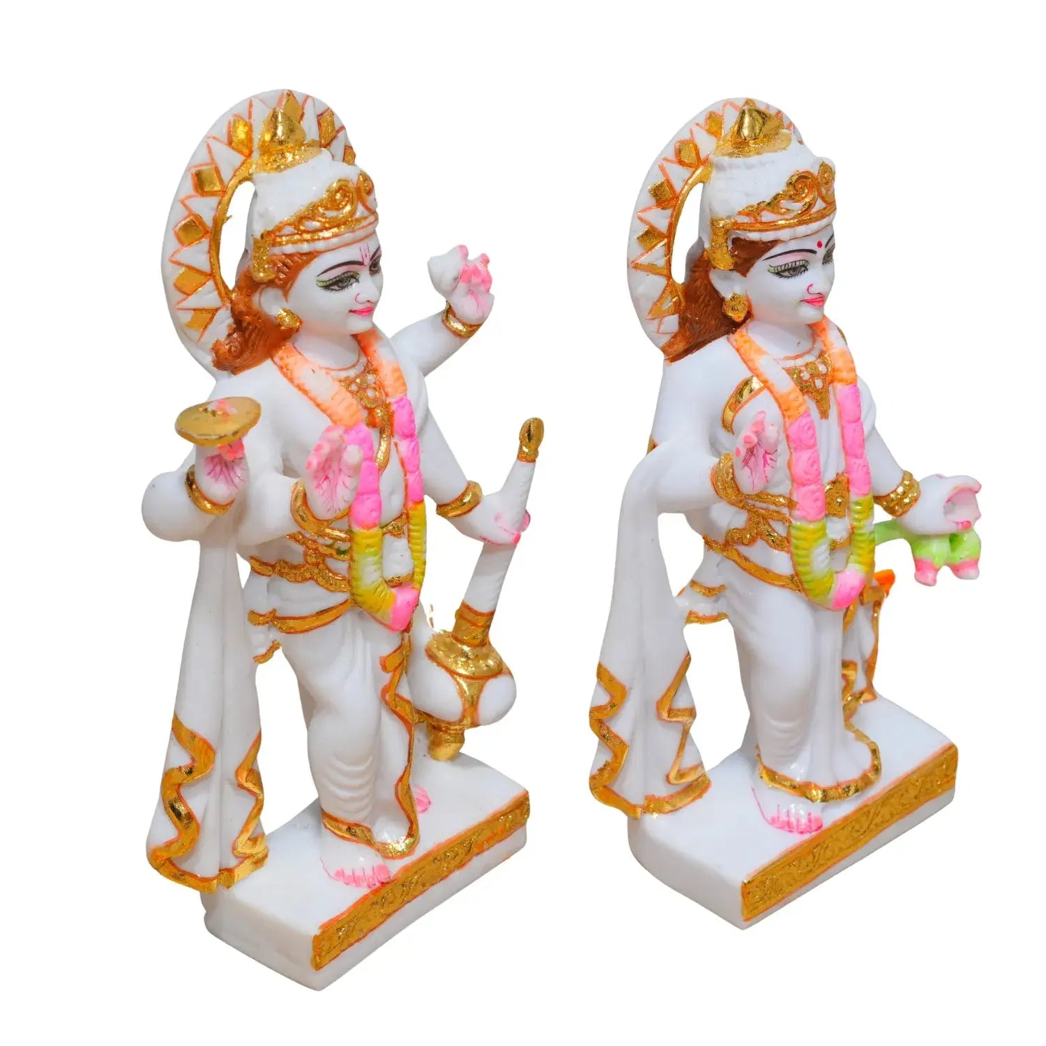 Two ornate statues with gold and pink accents on a white background