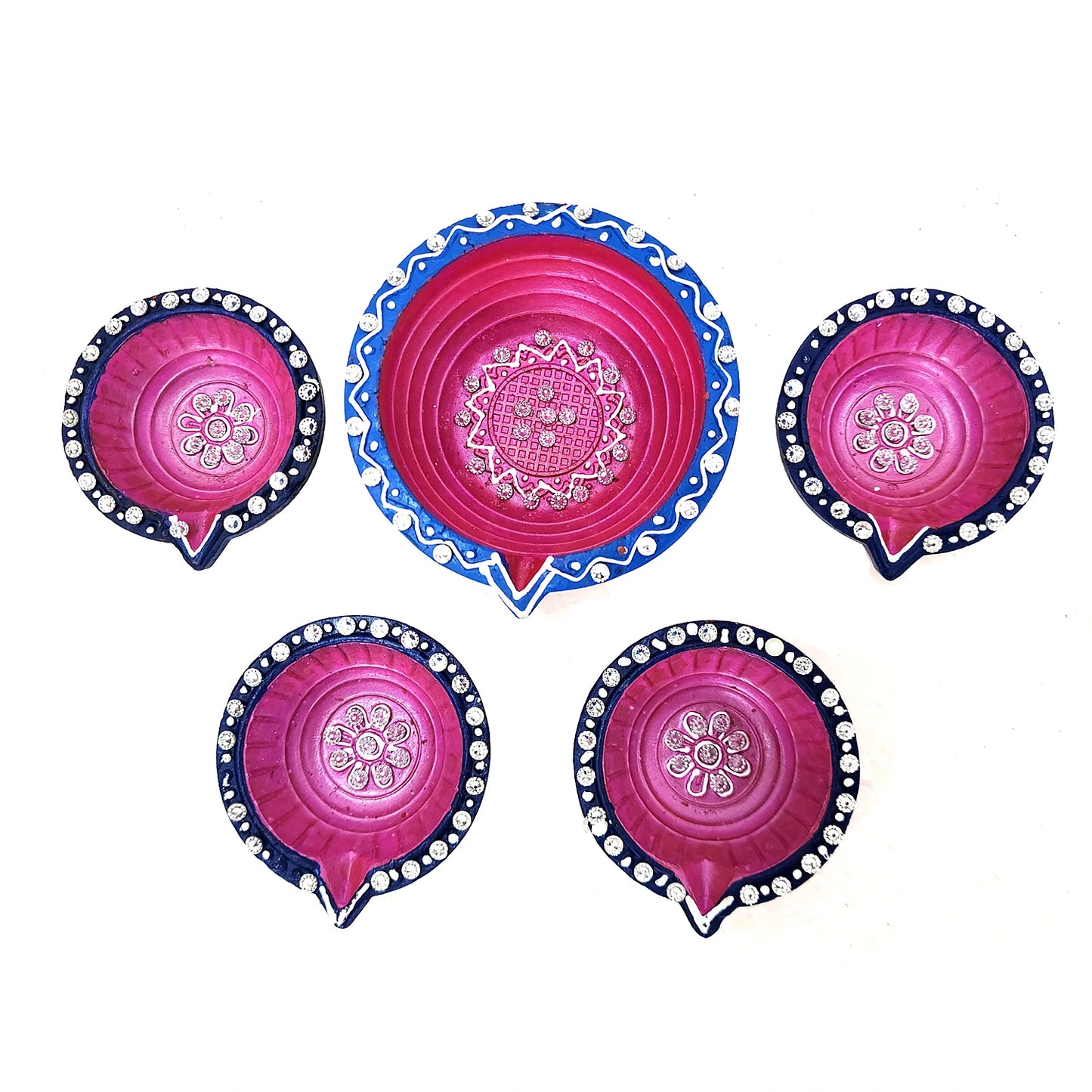 Set of five pink and blue decorative plates with intricate patterns on a white background