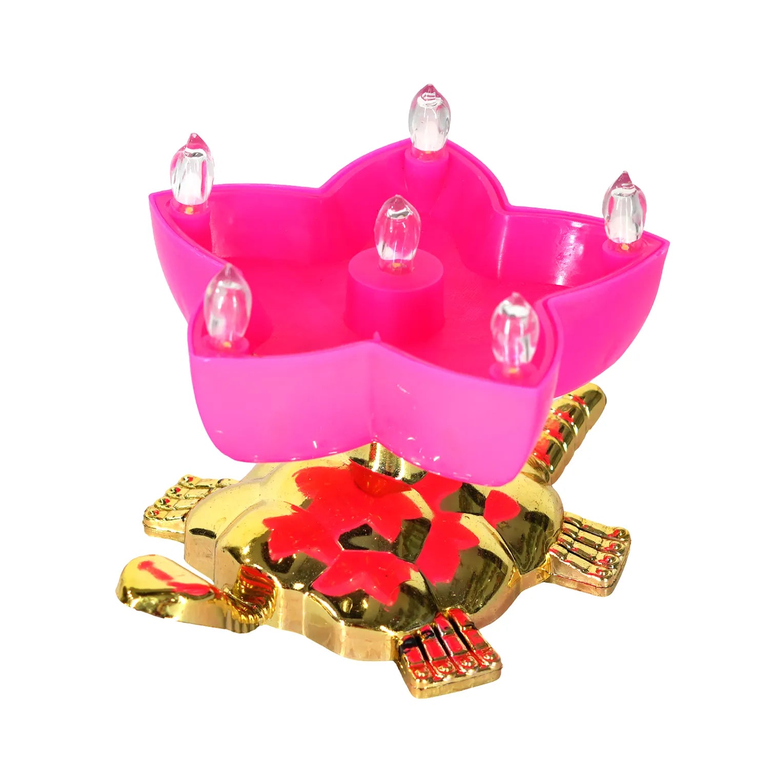 Pink candle holder with clear candles on a gold and red turtle-shaped base