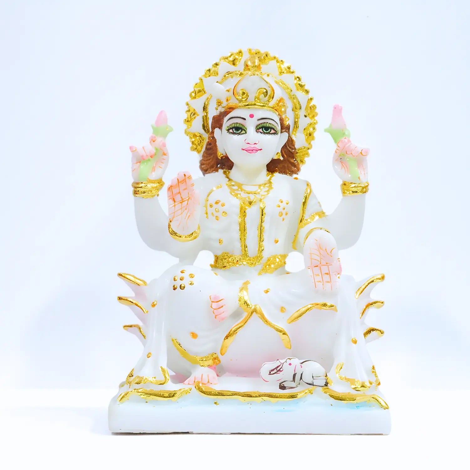 Decorative statue of a deity with gold and white colors on a light blue background