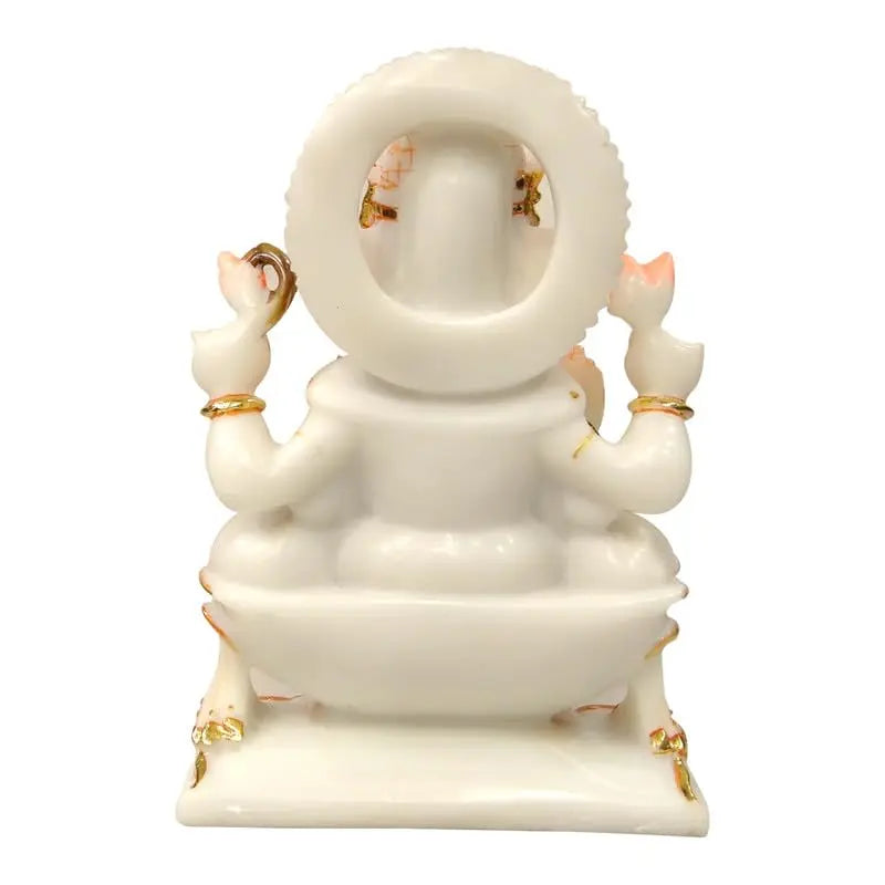 White marble statue with gold accents on a white background