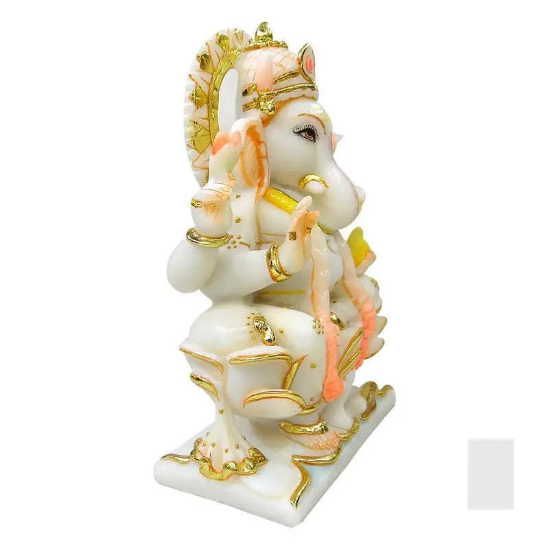 Decorative statue of a deity with gold and pink accents on a white background