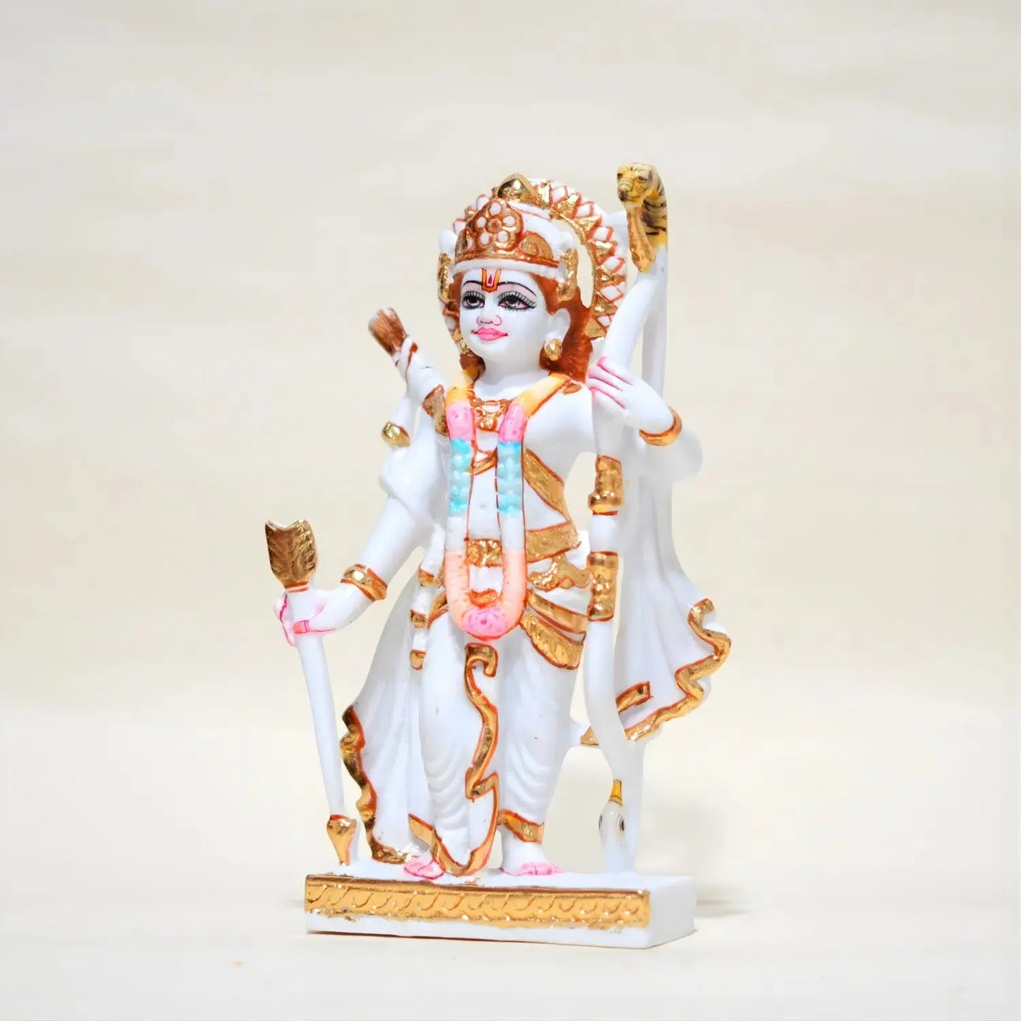 Colorful statue of a deity on a white background