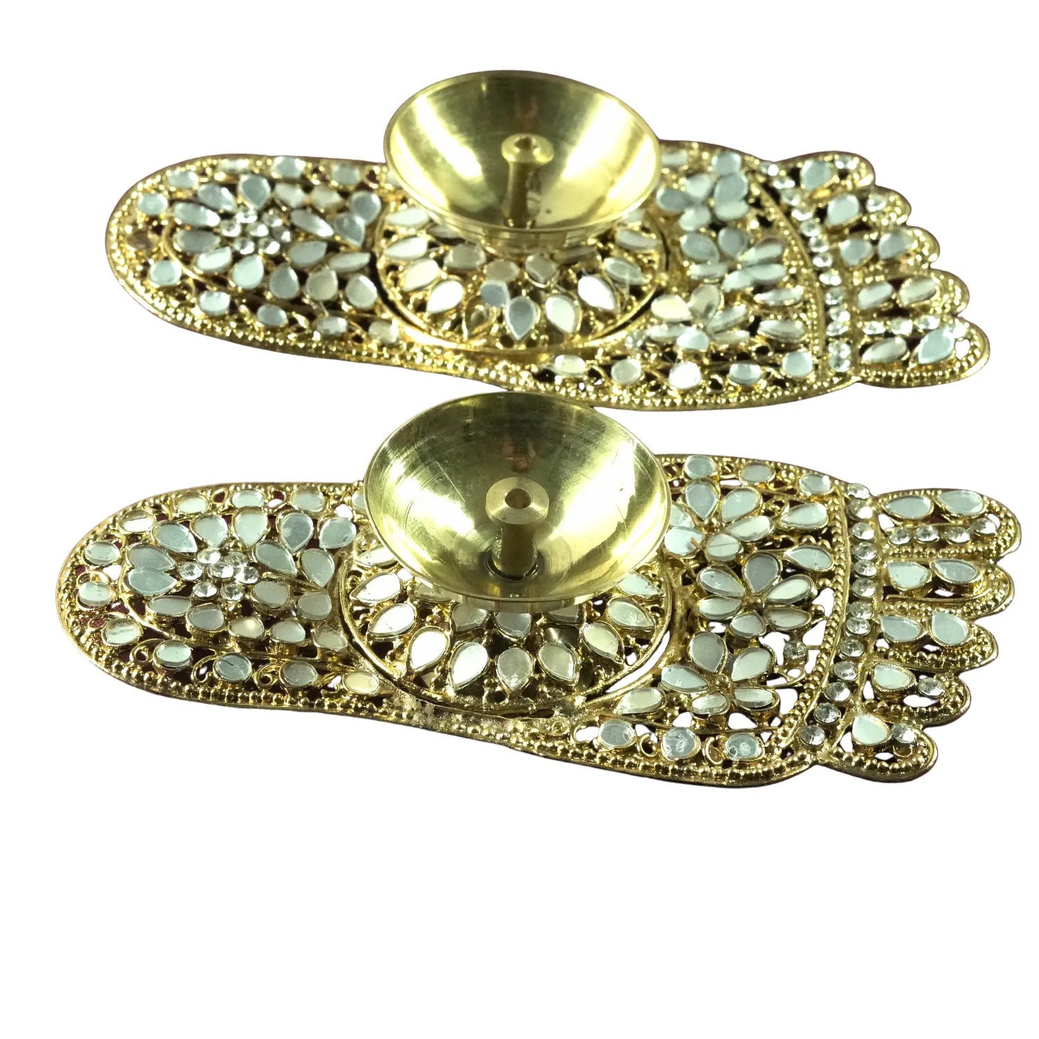 Pair of gold earrings with gemstone accents on a white background