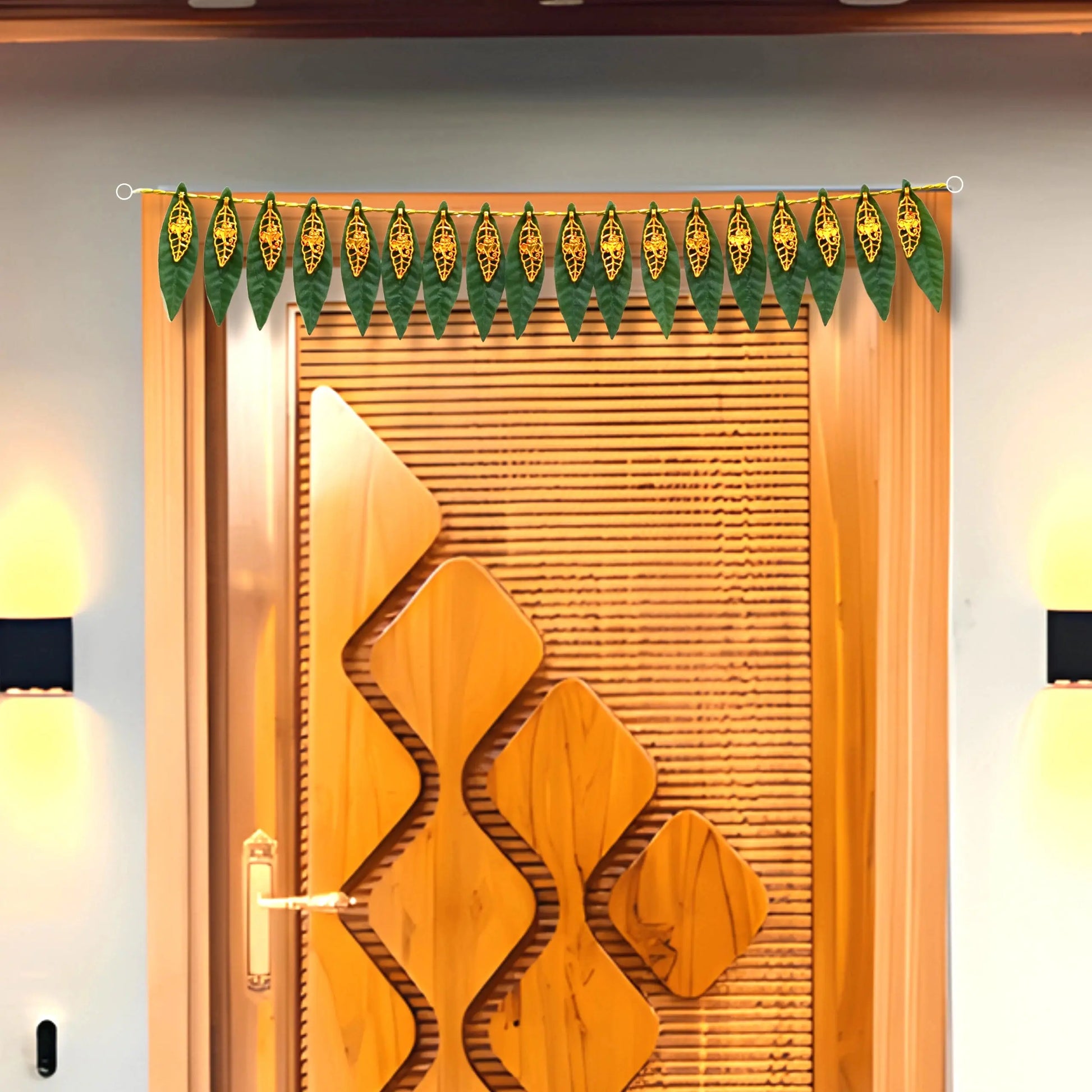 Decorative green leaf garland hanging above a wooden door with geometric design.