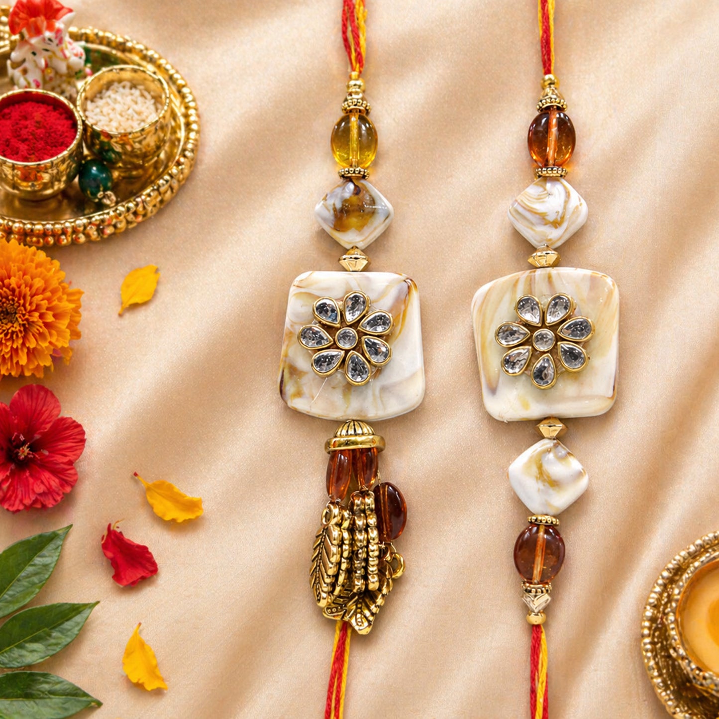 Exquisite Bhaiya-Bhabhi Lumba Rakhi Set with Kundan Flower Design & Golden Tassels By Uphakaro