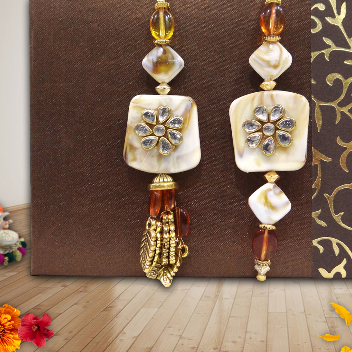 Exquisite Bhaiya-Bhabhi Lumba Rakhi Set with Kundan Flower Design & Golden Tassels By Uphakaro