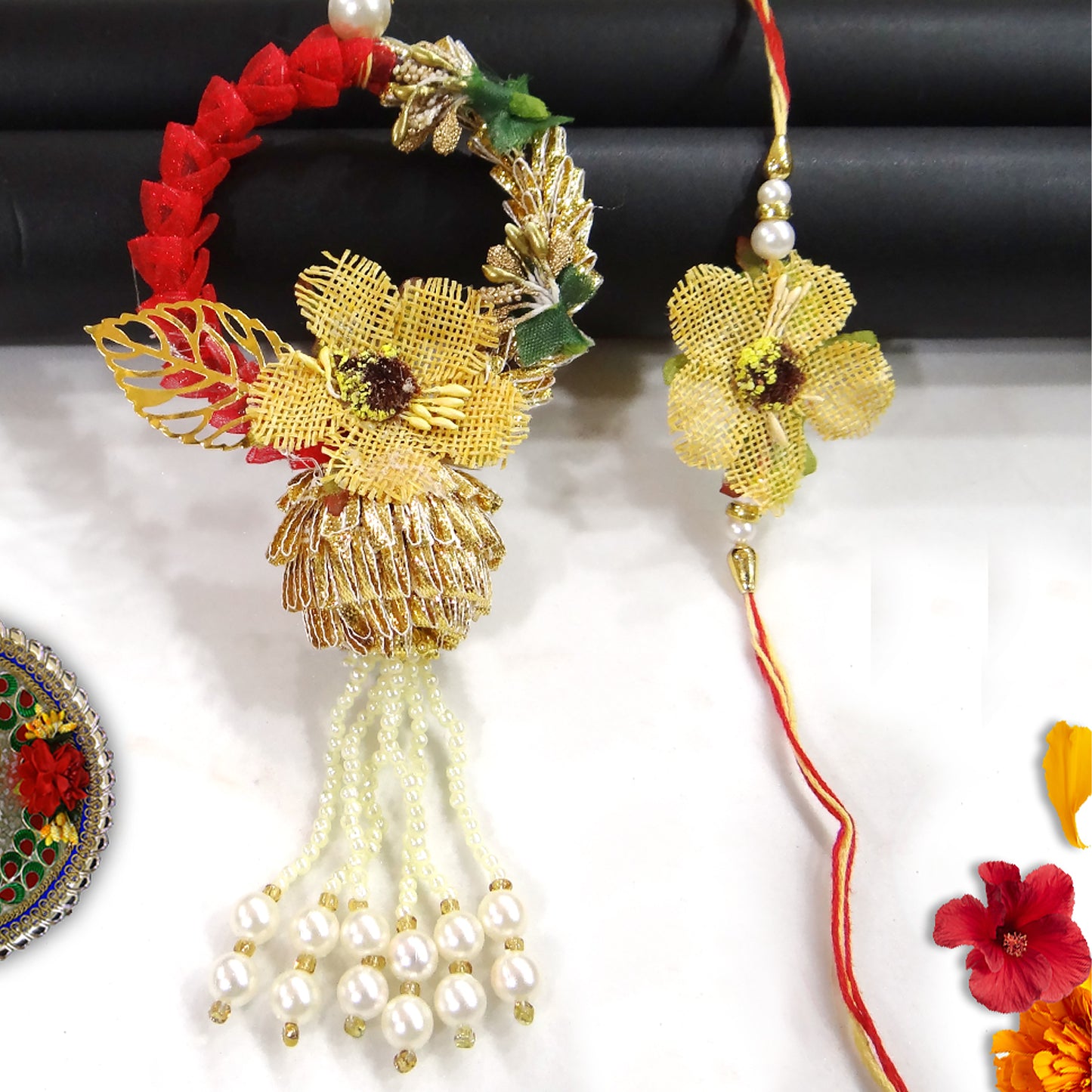 Elegant Floral Bhaiya Bhabhi Lumba Rakhi Set with Pearl Tassels & Golden Leaf Design Description and Bullet Point By Upharkaro