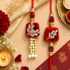 Premium Designer Red Stone Bhaiya Bhabhi Lumba Rakhi Set with Pearl Tassels, Crystal Leaf Work & Elegant Bracelet Thread for Raksha Bandhan Festive Gifting By Upharkaro