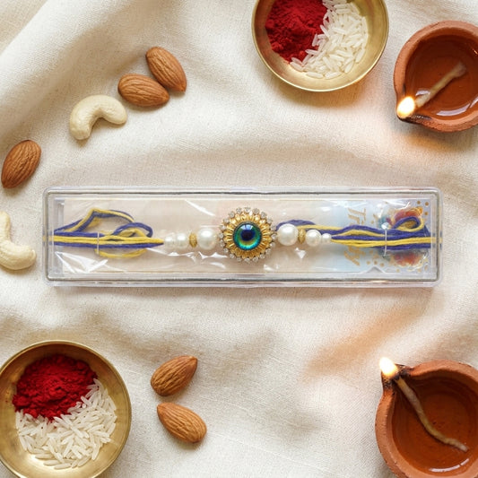 Traditional Mayur (Peacock) Rakhi with Sparkling American Diamonds and White Pearl Accents