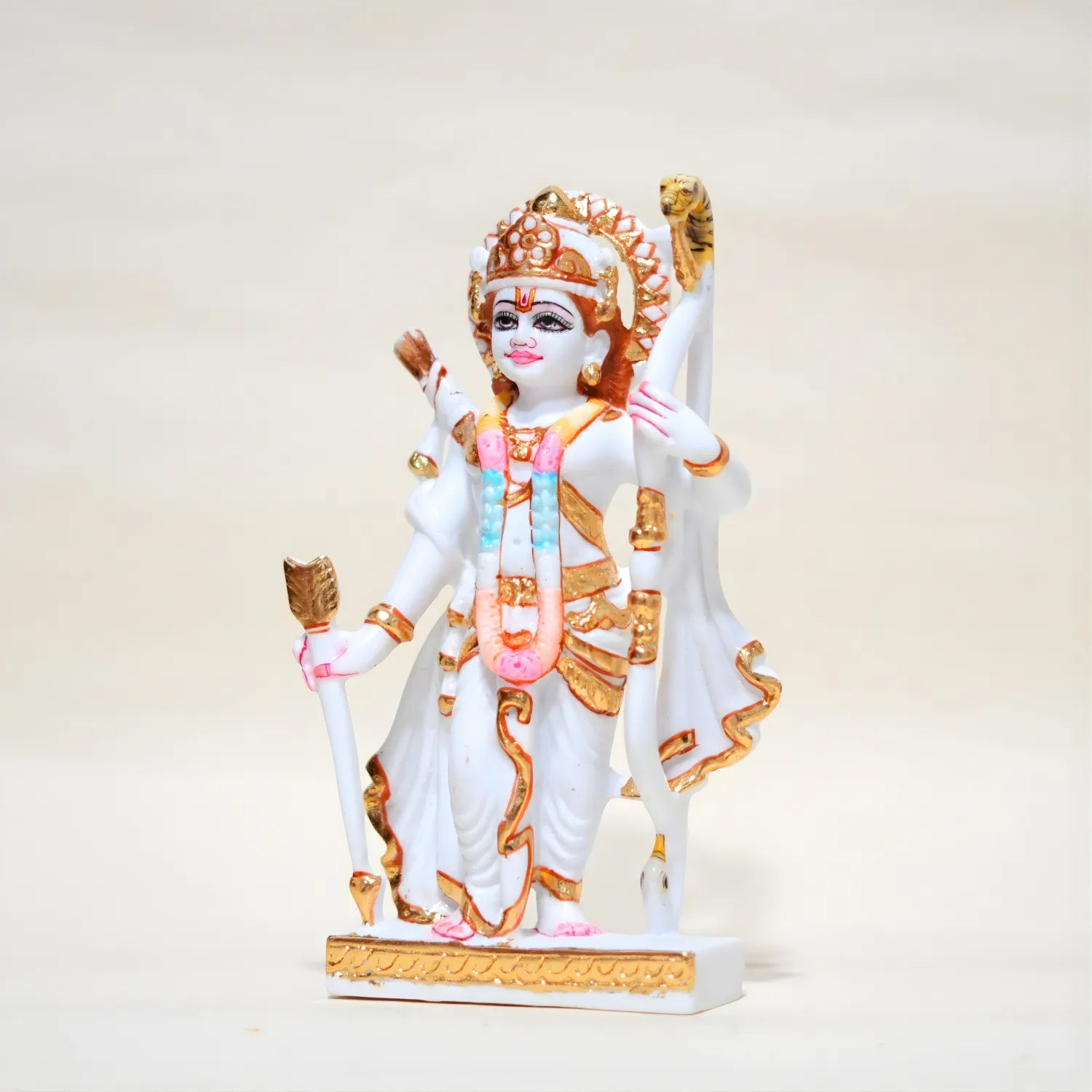 Colorful statue of a deity on a white background