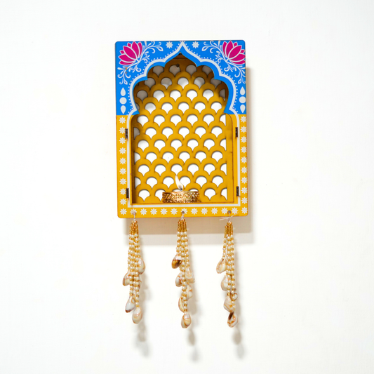 Handcrafted Rajasthani jharokha wall hanging with diya & pearl latkan. Perfect for home, mandir, Diwali décor & festive gifting.