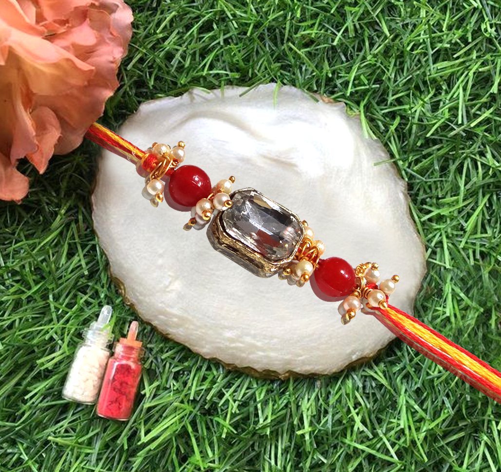 Elegant Handcrafted Stone Rakhi with Vibrant Red Beads and Golden Charms By Upharkaro