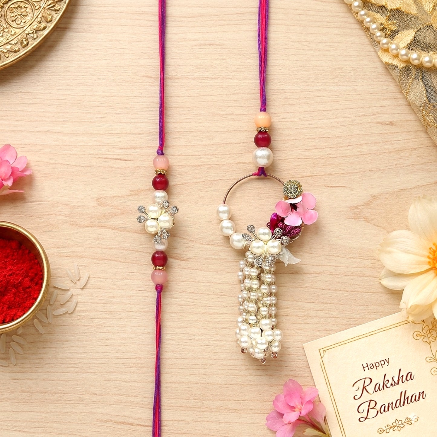 Elegant Pearl Floral Bhaiya Bhabhi Lumba Rakhi Set with Tassel & Pink Crystal Design