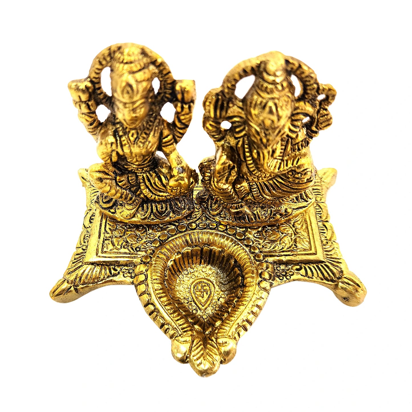 Gold-colored decorative item with two figures on a white background