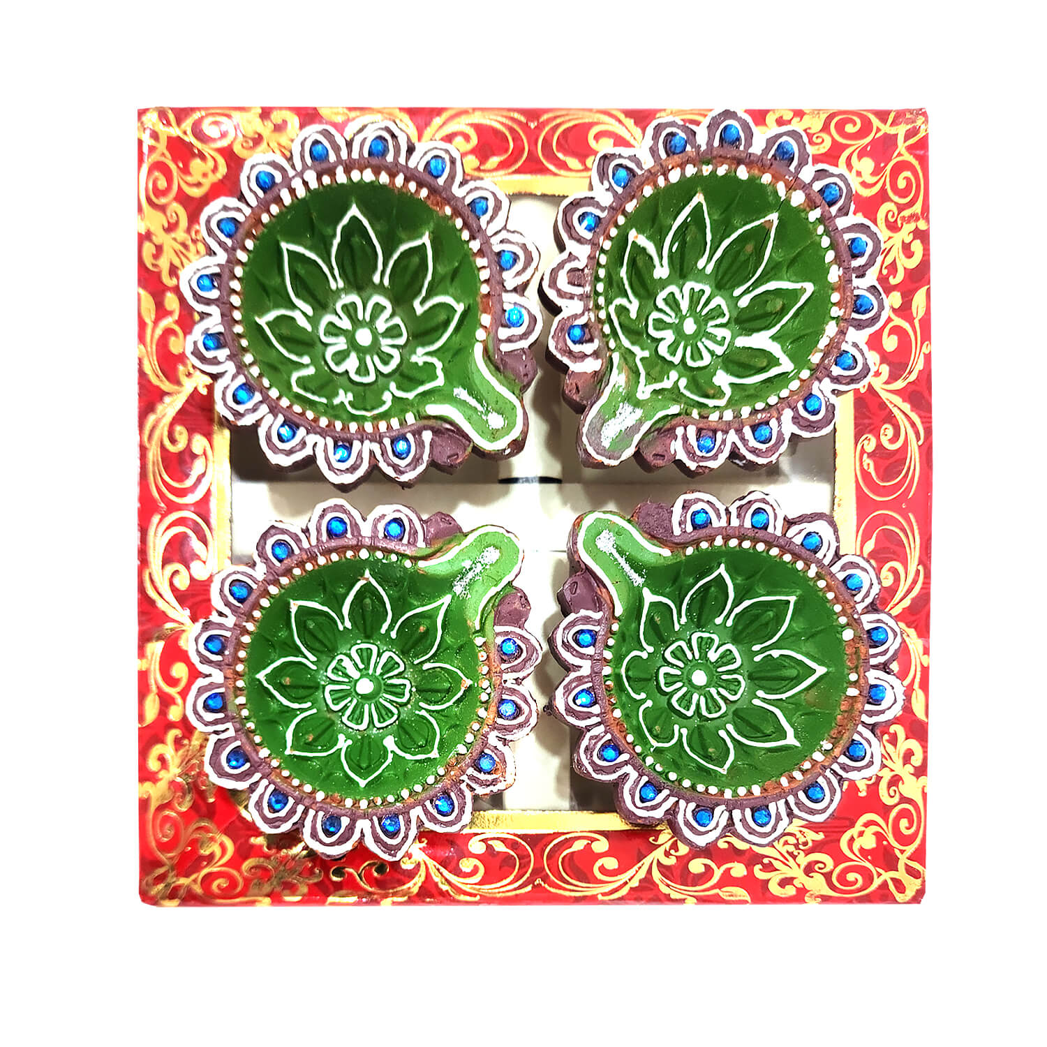 Decorative diya set with green designs in a colorful box