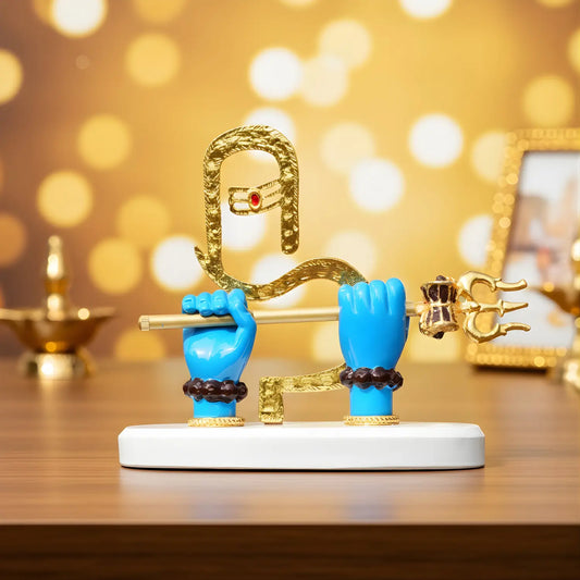 Decorative figurine with blue hands holding a gold snake against a blurred golden background
