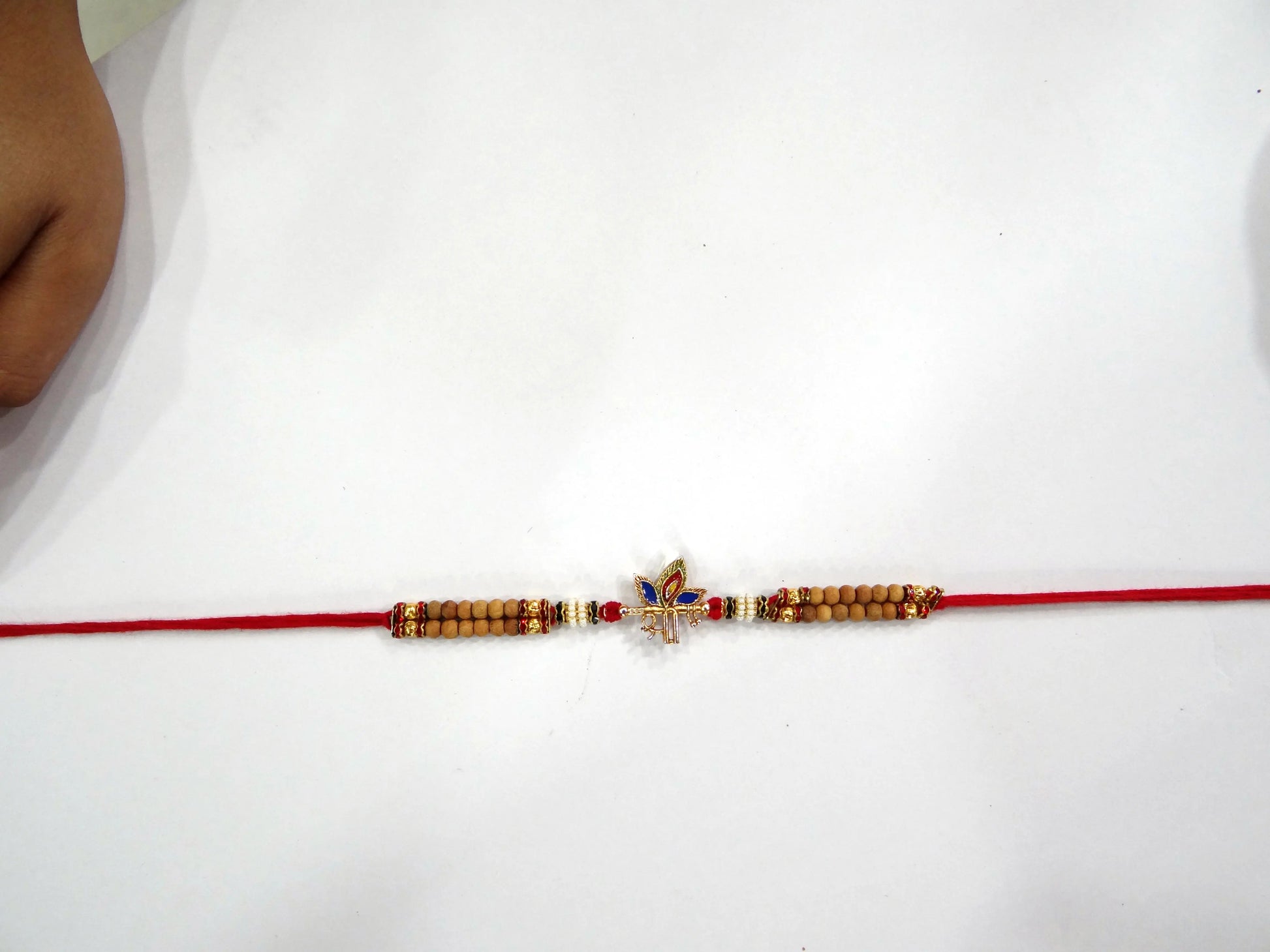 Shri Morpankh Red Stone Rakhi for Bhaiya By Upharkaro – Divine Blessings & Gemstone Elegance | Raksha Bandhan 2024 Special-Upharkaro