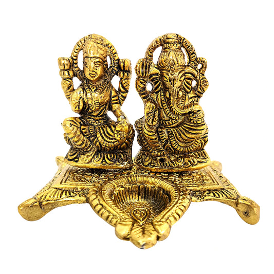 Gold-colored statue of a deity on a white background