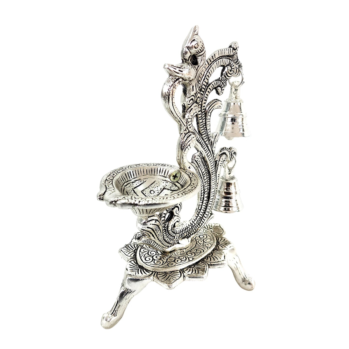 Decorative silver oil lamp with intricate designs on a white background