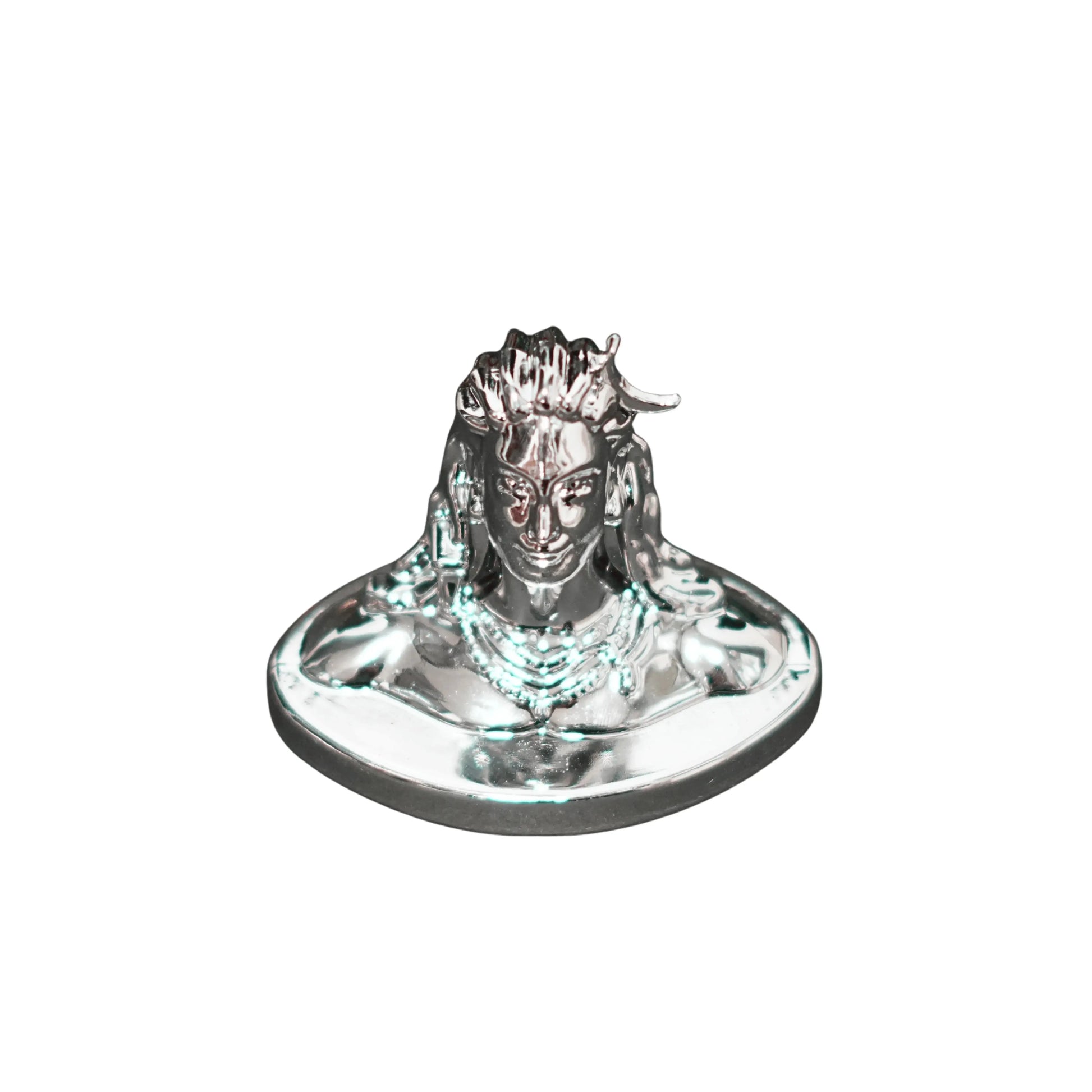 Metallic figurine of a deity on a white background