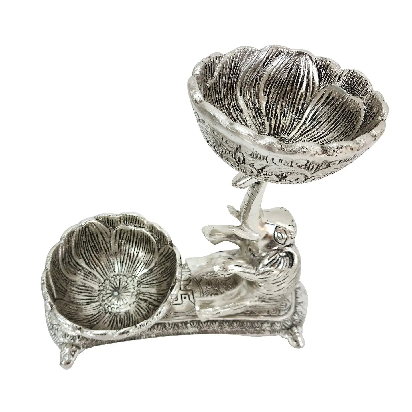 Decorative silver shell dish on a white background
