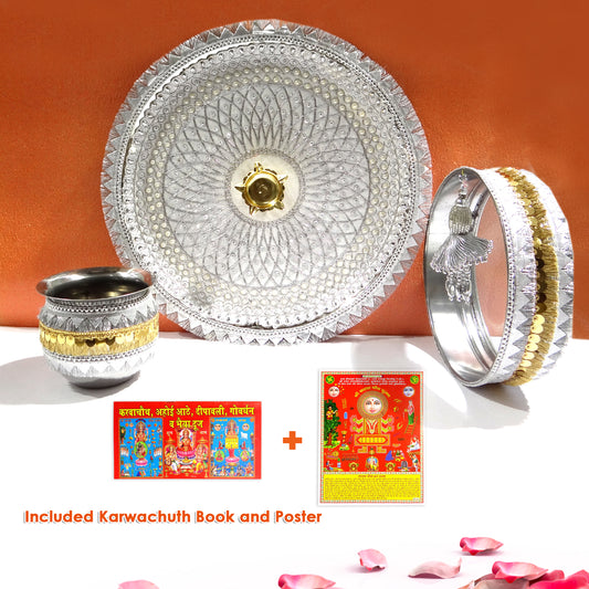 Decorative silver platter with gold accents, cups, and Karwachauth books and posters on a white surface.