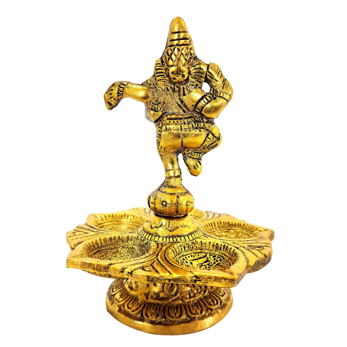 Gold-colored statue of a deity on top of a decorative oil lamp with intricate designs.