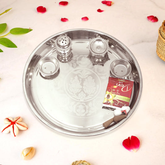 Silver tray with decorative items on a light background