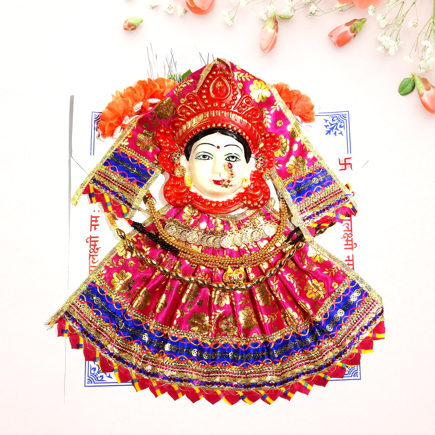 Colorful traditional doll with intricate design on a white background