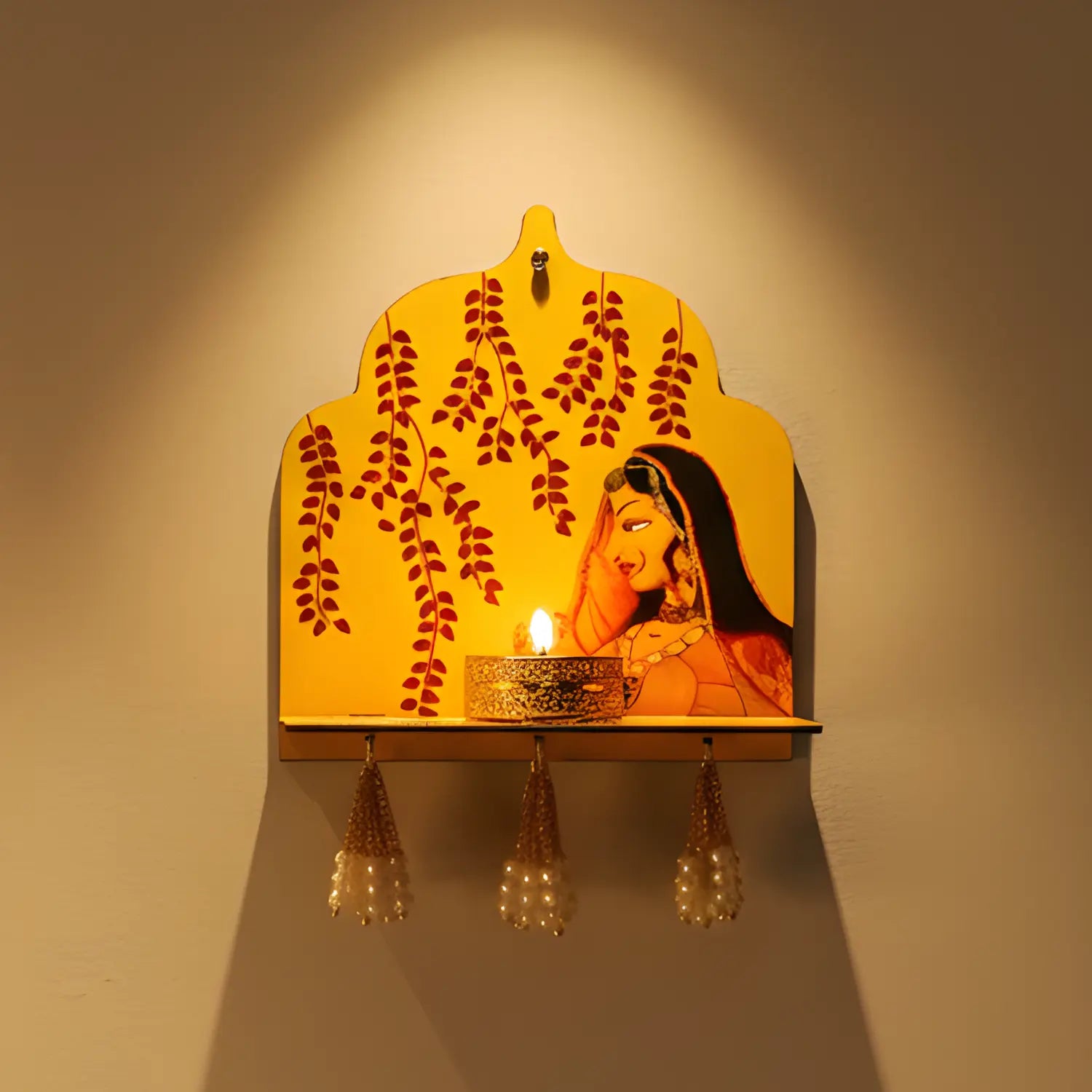 Decorative wall light with a woman's face and floral design on a yellow background.