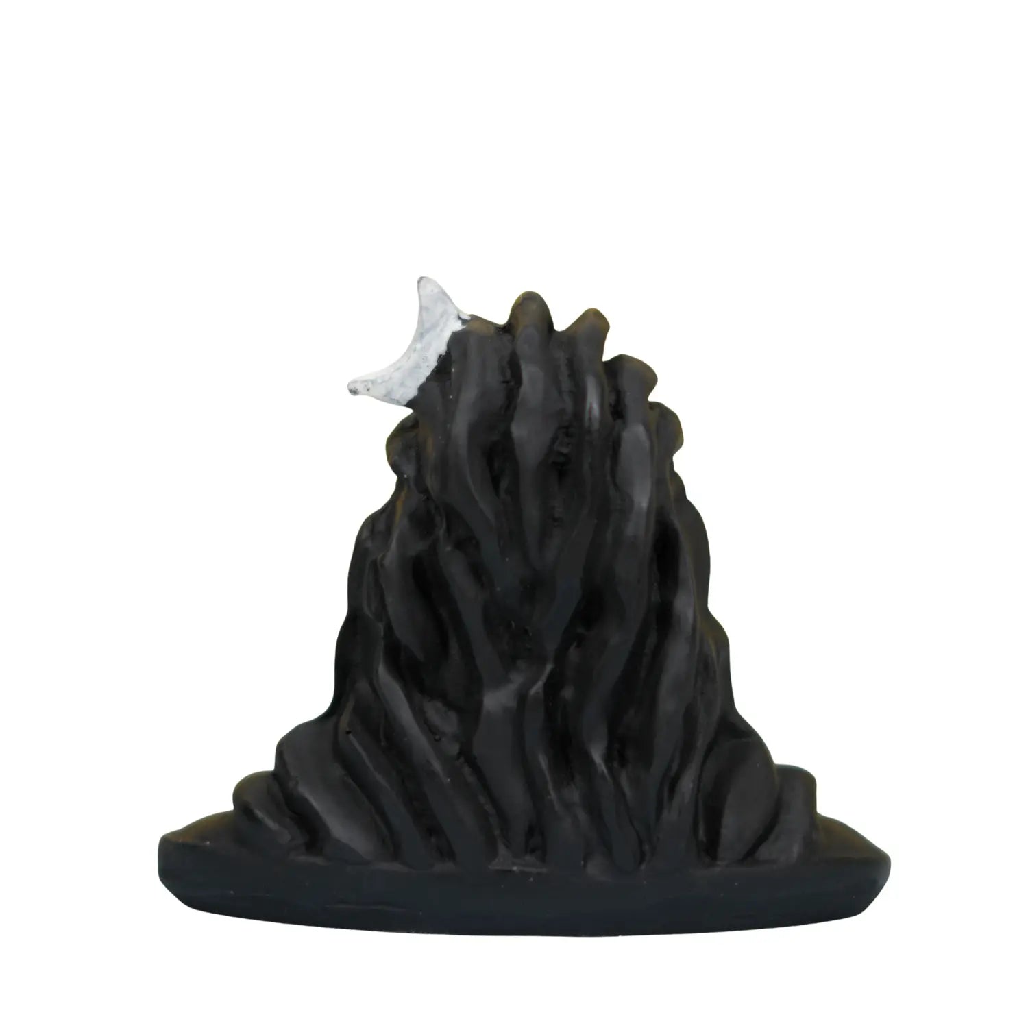 Black mountain-like sculpture with a small white object on top against a white background