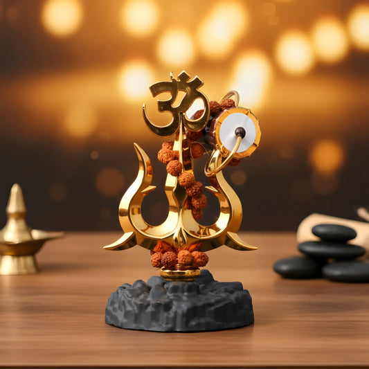 Decorative statue with religious symbols on a wooden surface with a blurred background