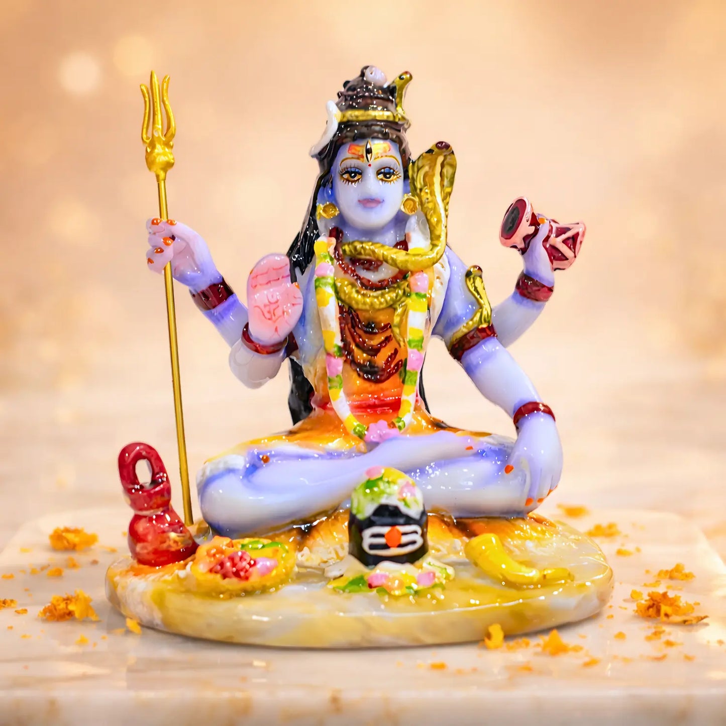 Colorful statue of a deity with a blurred background