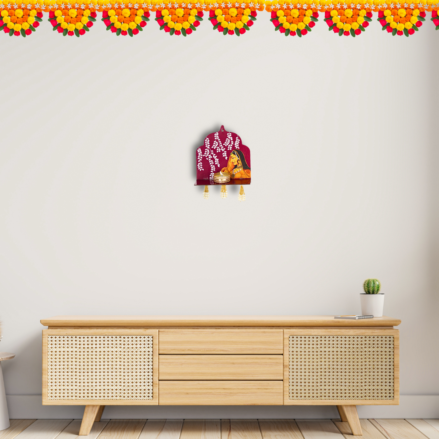 Wooden cabinet with decorative items against a white wall with floral border