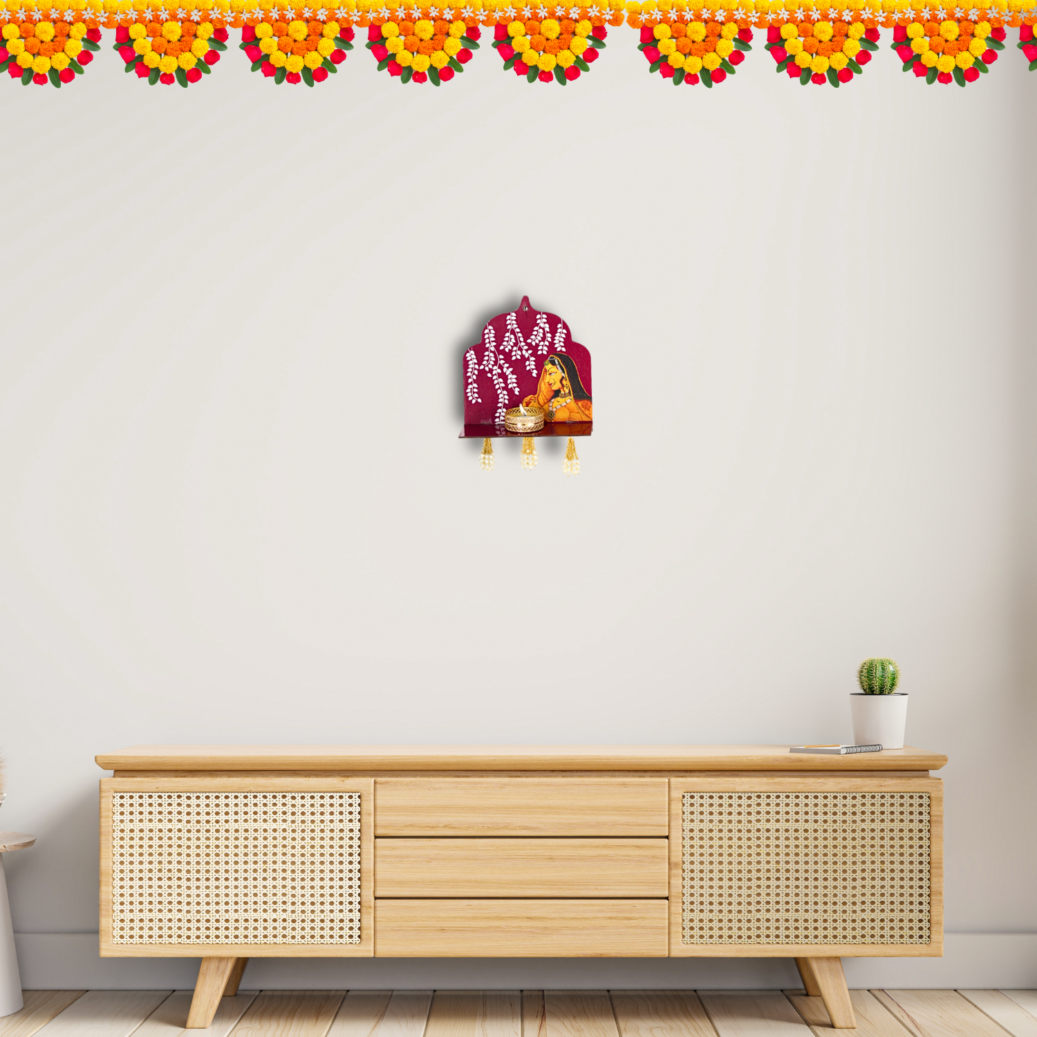Wooden cabinet with decorative items against a white wall with floral border