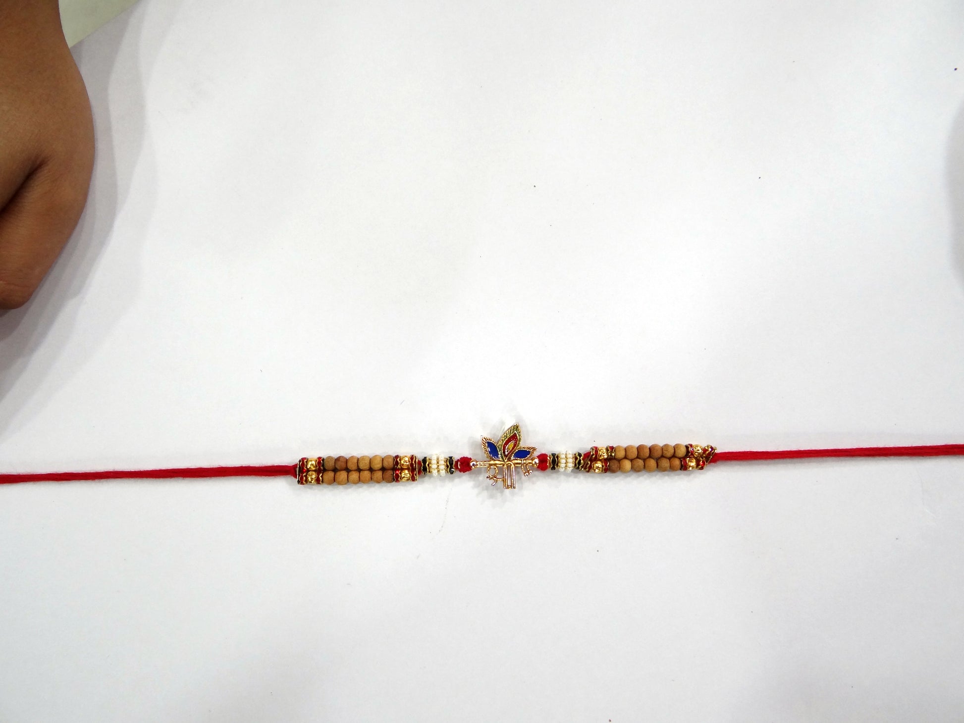Shri Morpankh Red Stone Rakhi for Bhaiya By Upharkaro – Divine Blessings & Gemstone Elegance | Raksha Bandhan 2024 Special-Upharkaro