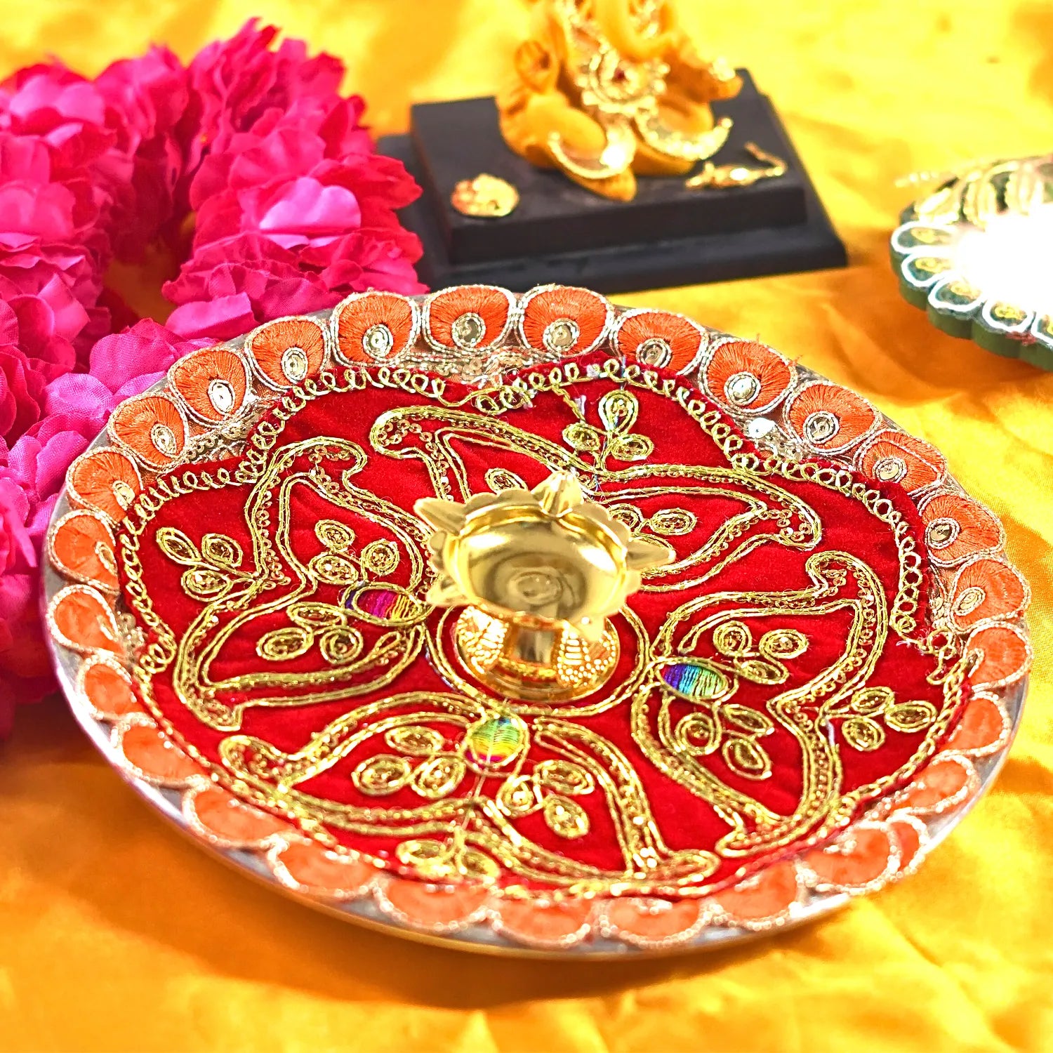 Decorative plate with intricate designs on a yellow background