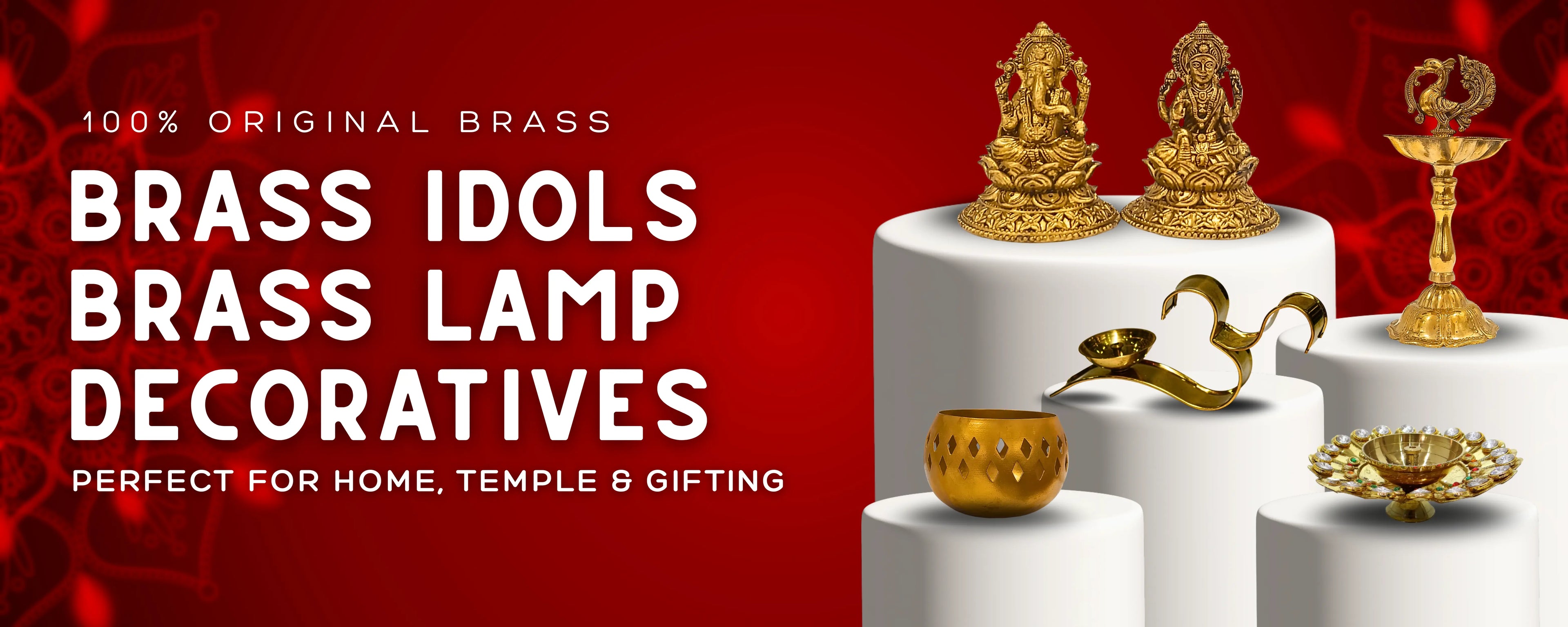 Brass idols and lamp decoratives on a white pedestal with a red background