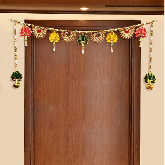 Decorative garland with colorful elements hanging above a wooden door.