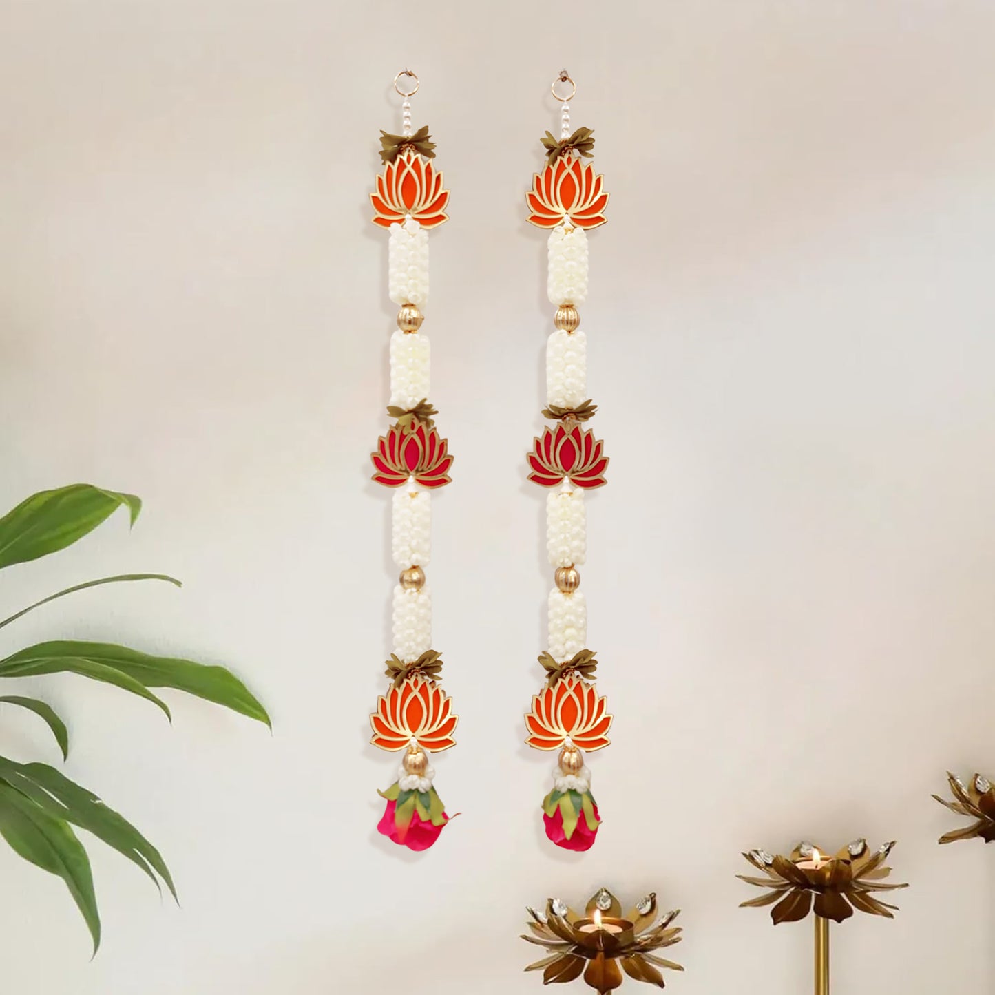 Decorative earrings with floral designs on a neutral background