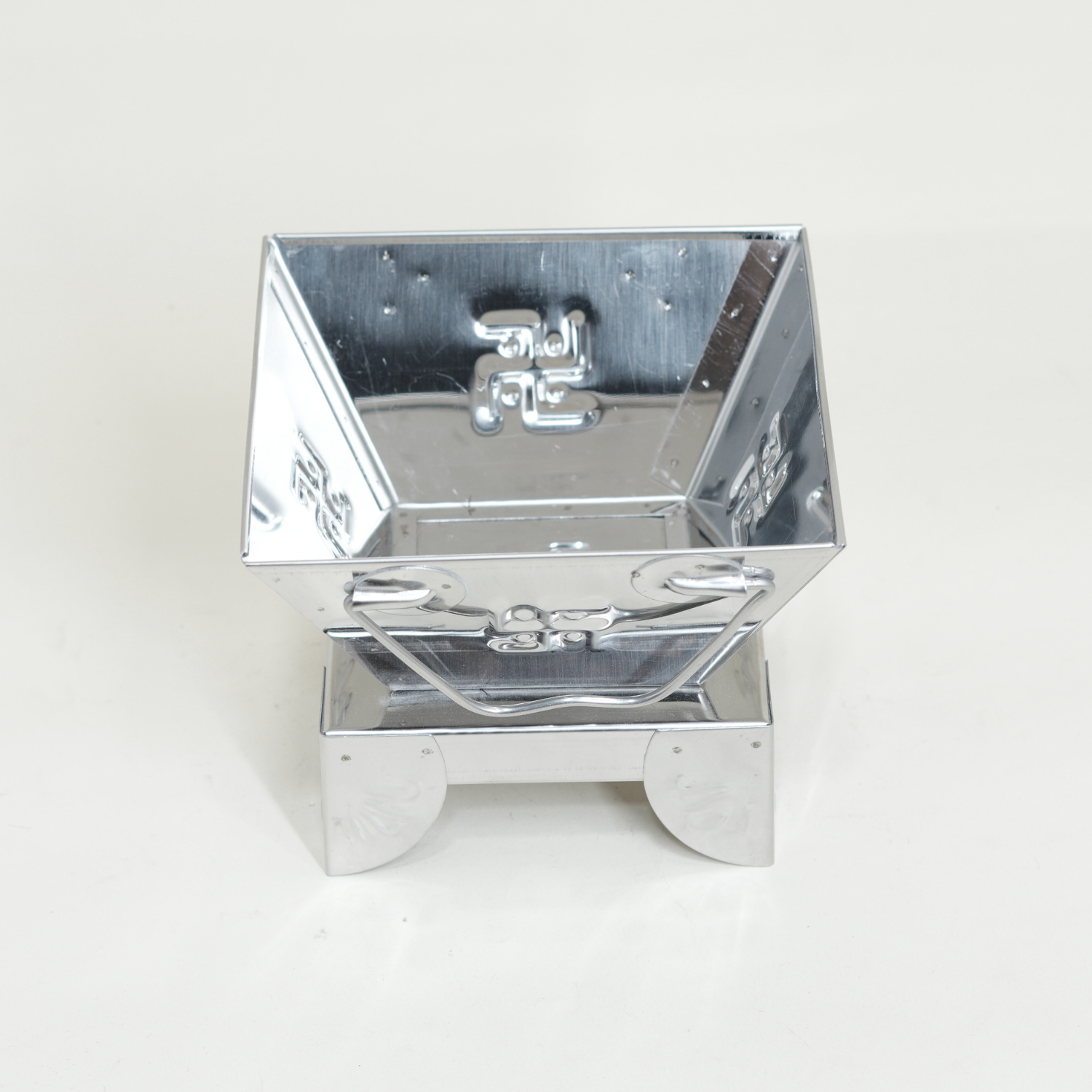 Metallic reflective box on a white background