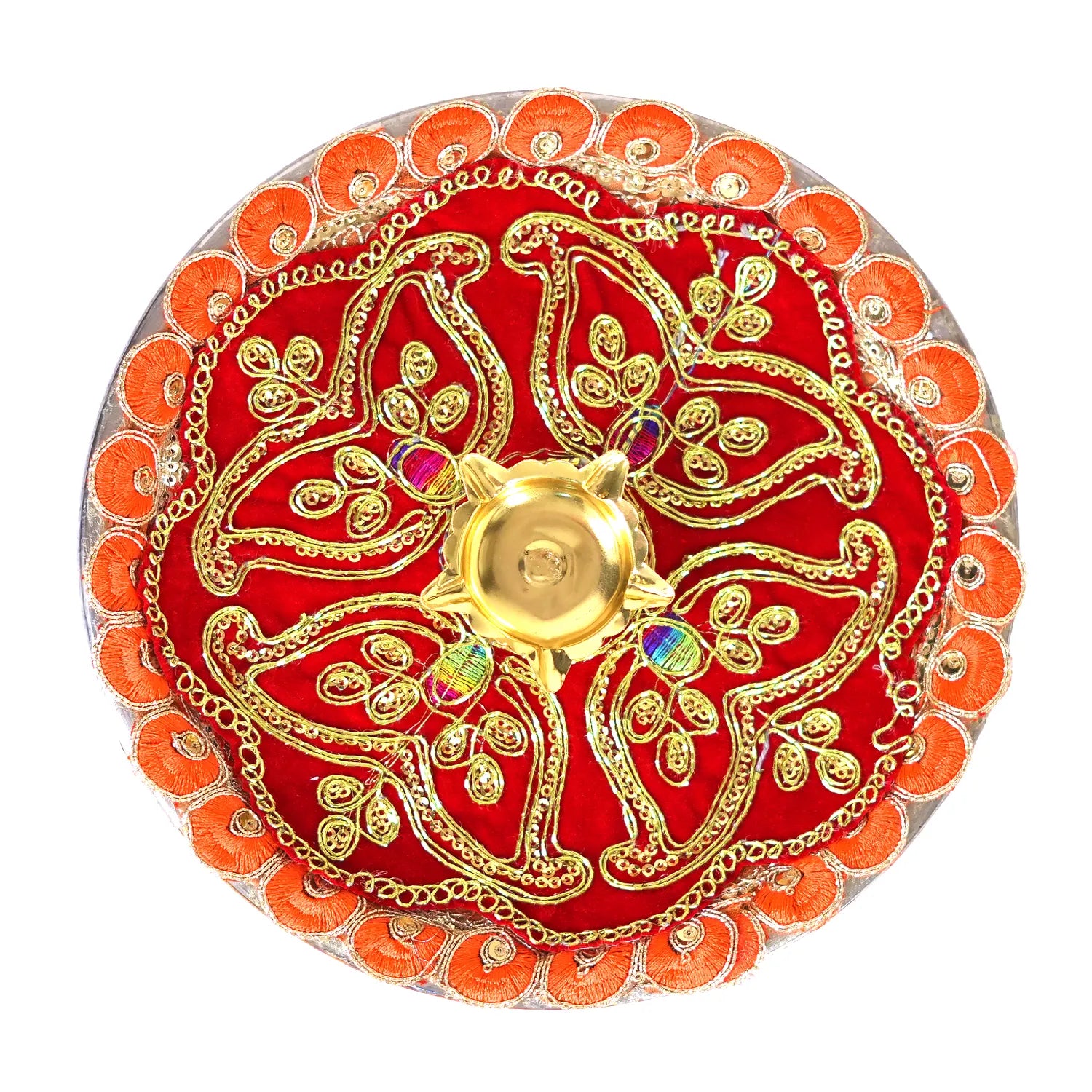 Decorative red and gold plate with intricate designs on a white background